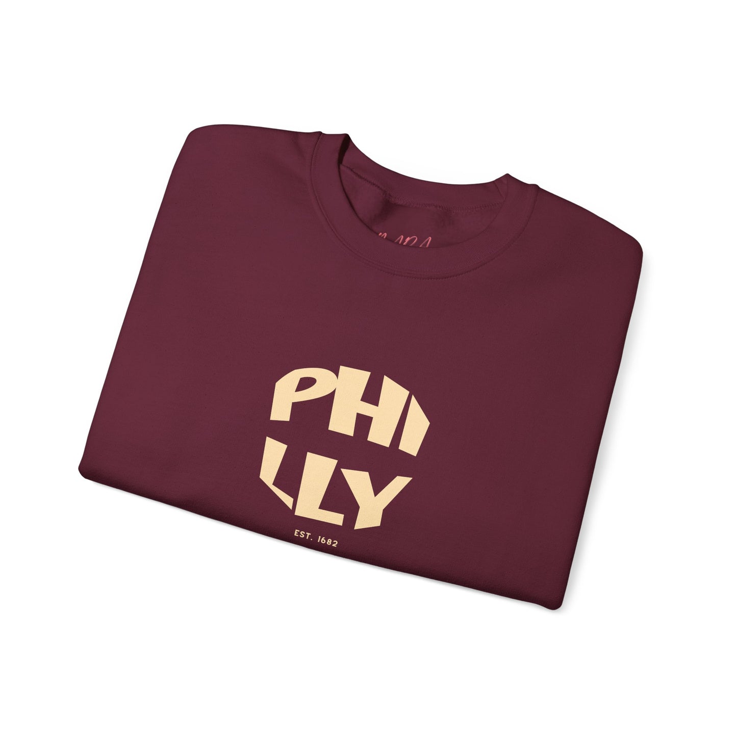 Folded maroon sweatshirt with 'PHILLY' printed in gold on a white background