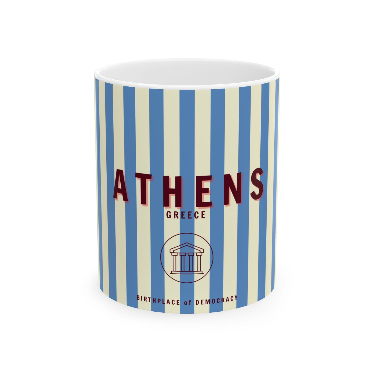 A ceramic mug with blue and white stripes featuring the word 'ATHENS' along with 'Greece' and a classical column illustration.