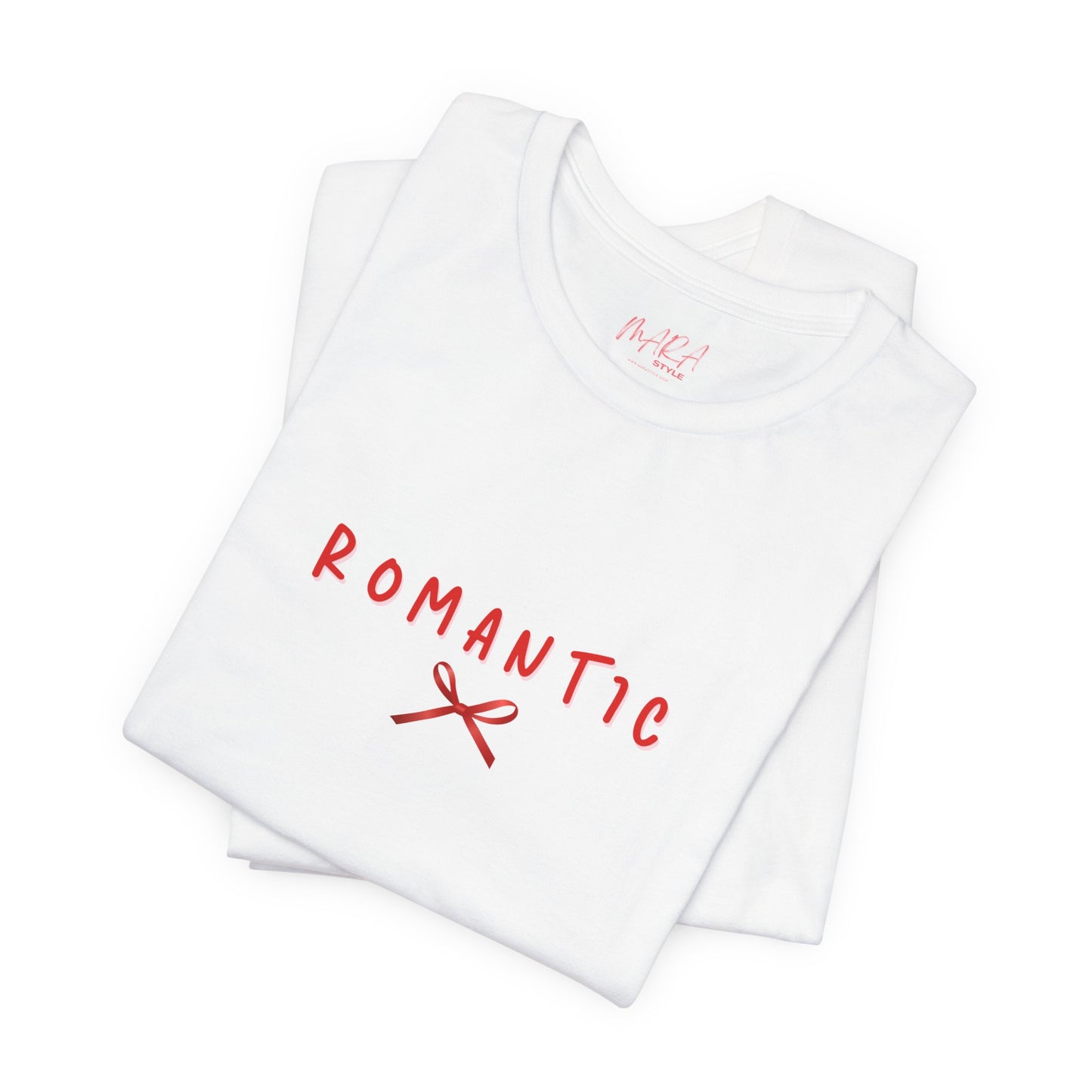White t-shirt with red text 'ROMANTIC' and a bow graphic on a white background