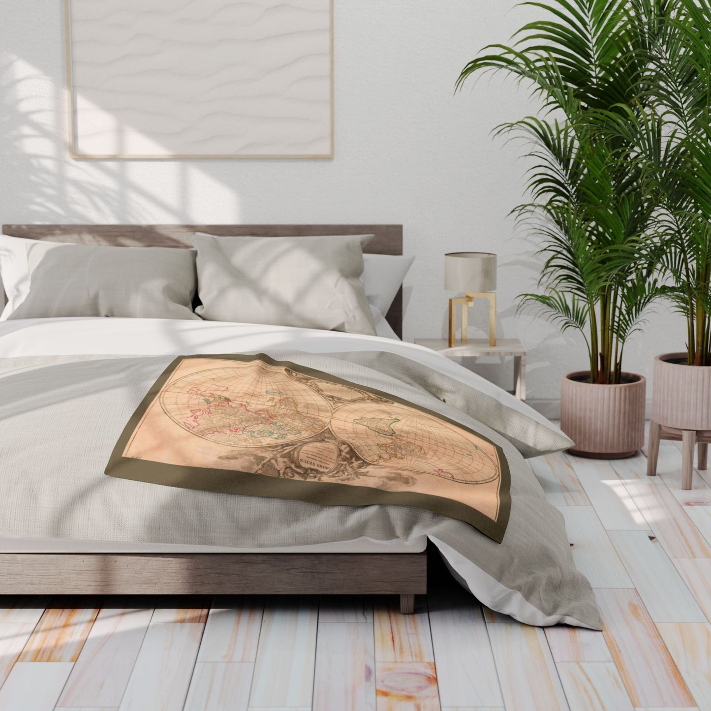 Bedroom with a decorative world map blanket on a bed, plants, and a lamp.