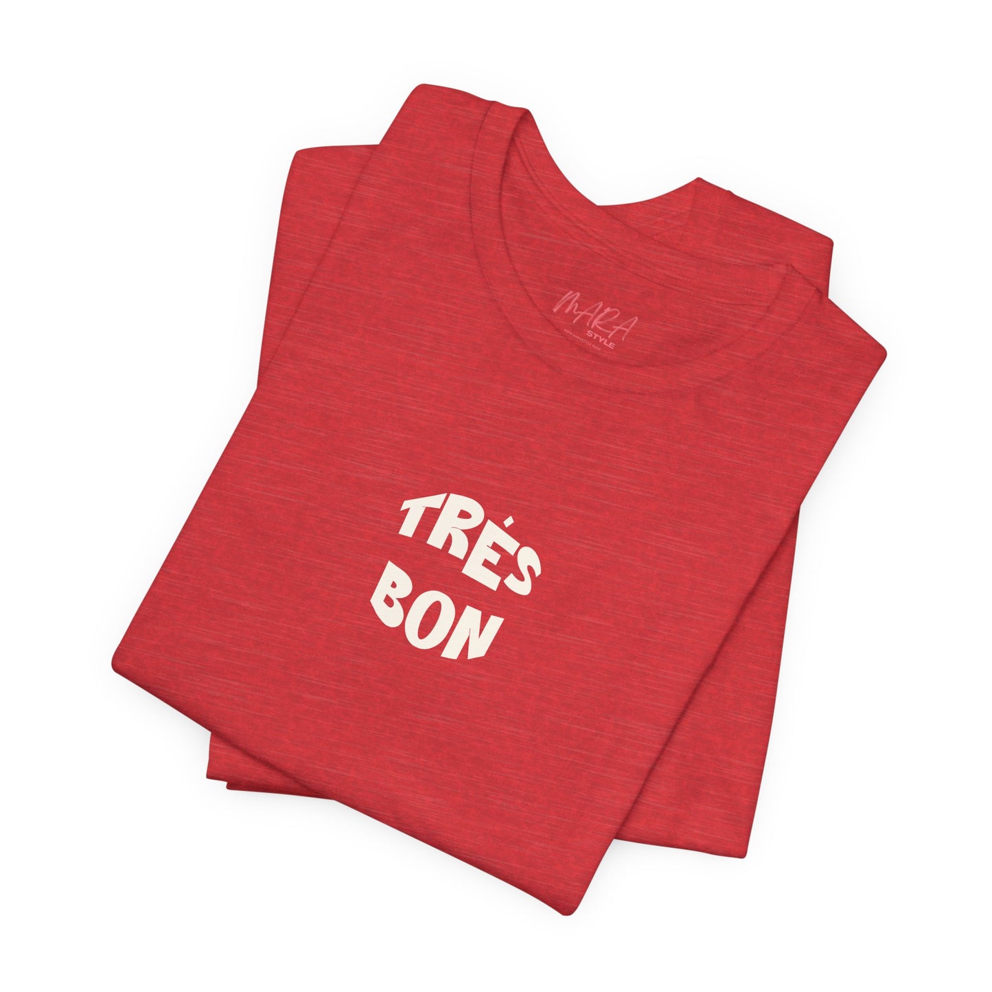 Folded red t-shirt with 'TRèS BON' text on a white background