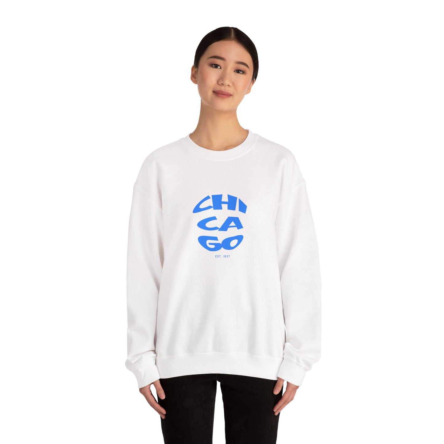Person wearing a white sweatshirt with 'CHICAGO' printed in blue on a white background