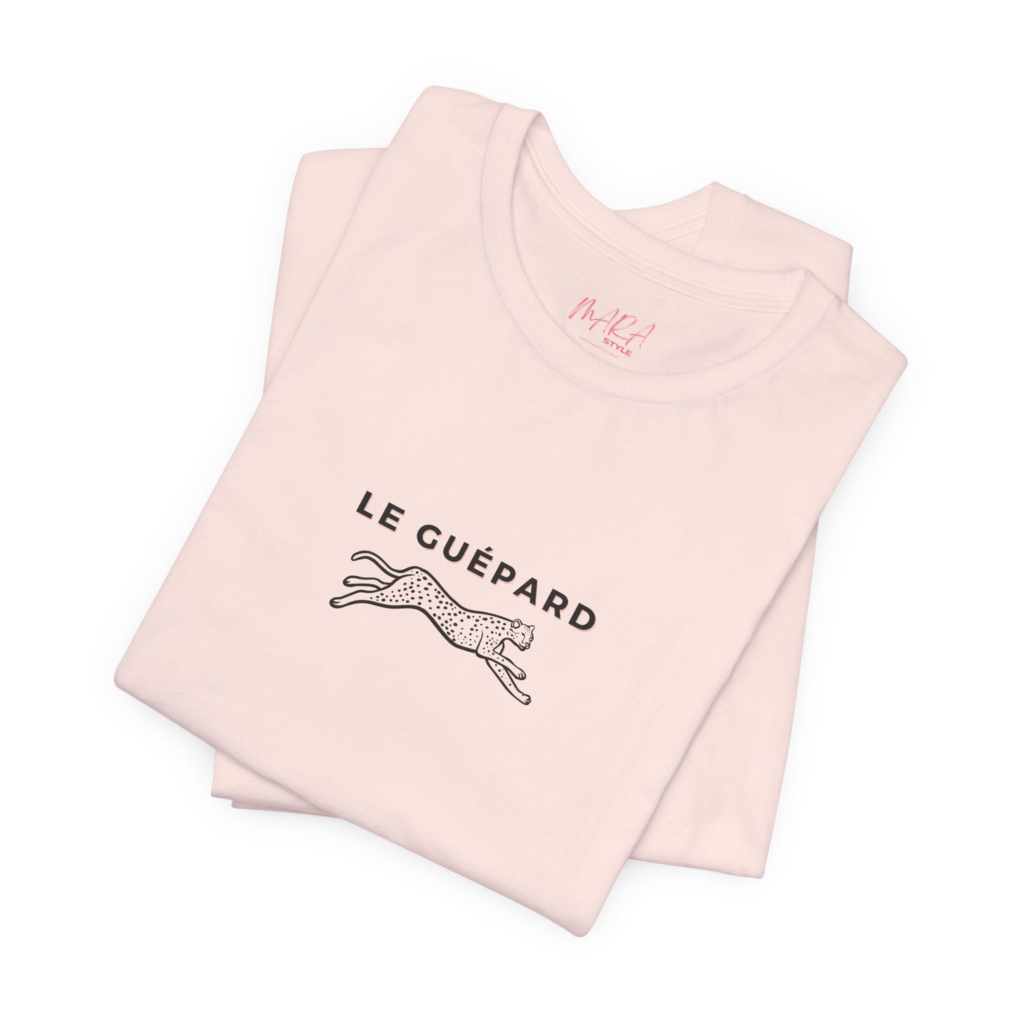Folded pink tank top with 'Le Guépard' text and logo on a white background