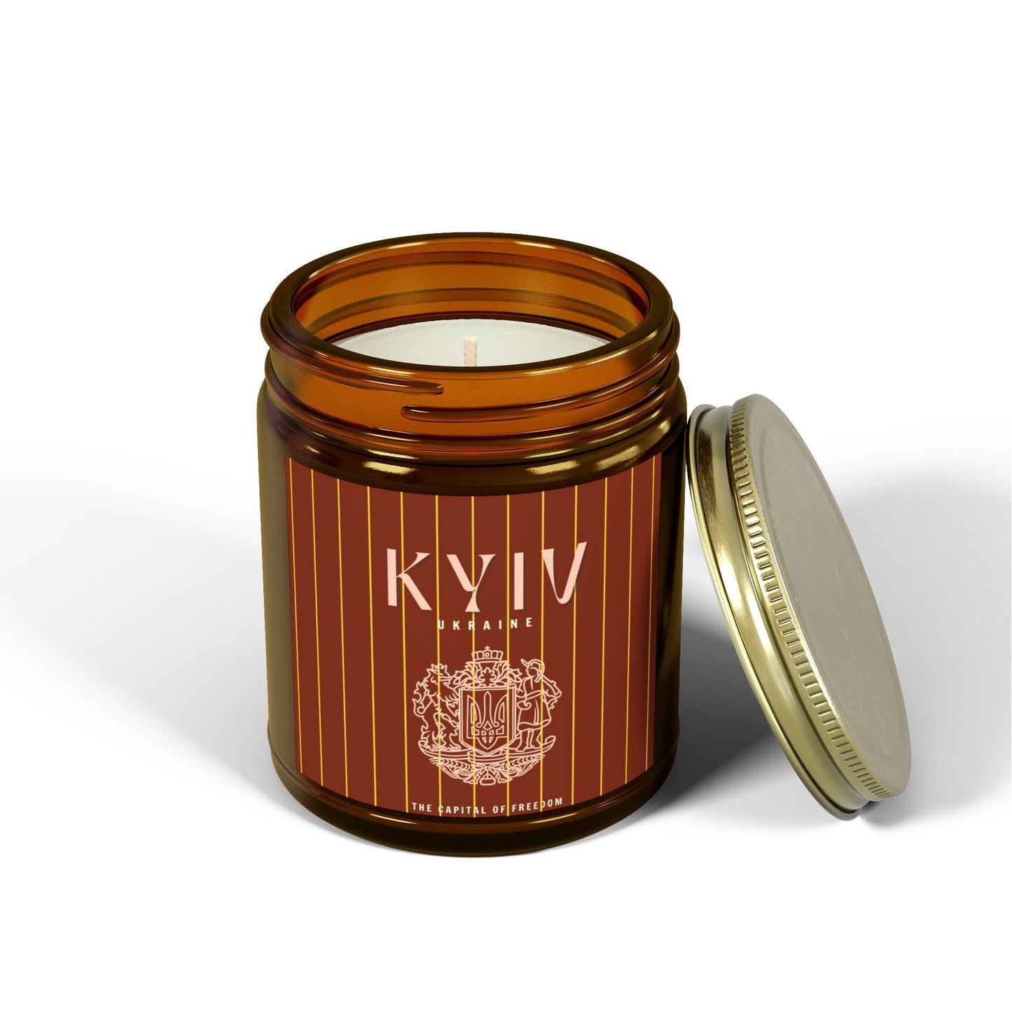 Candle in an amber jar with a decorative label on a white background