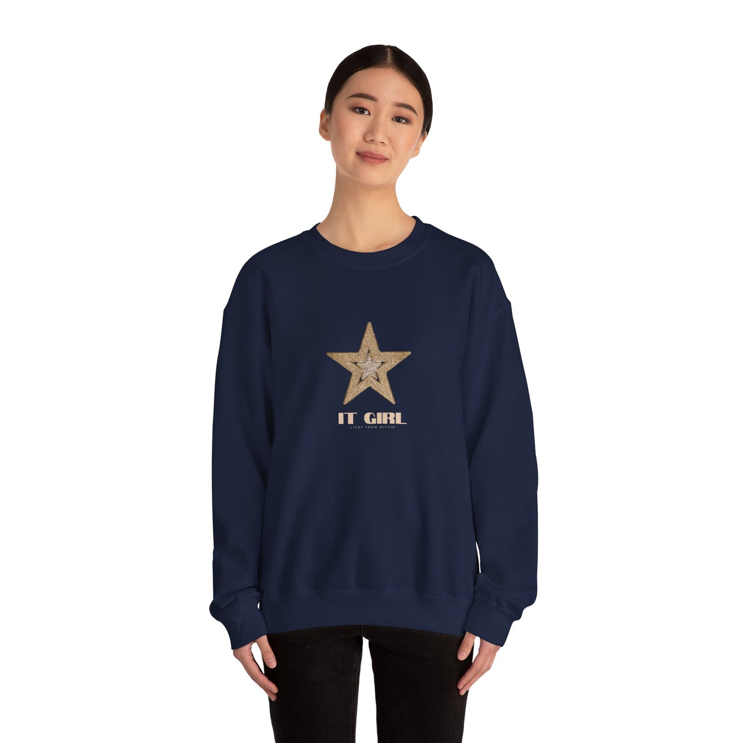 Navy blue sweatshirt with a star and 'IT GIRL' text worn by a model on a white background