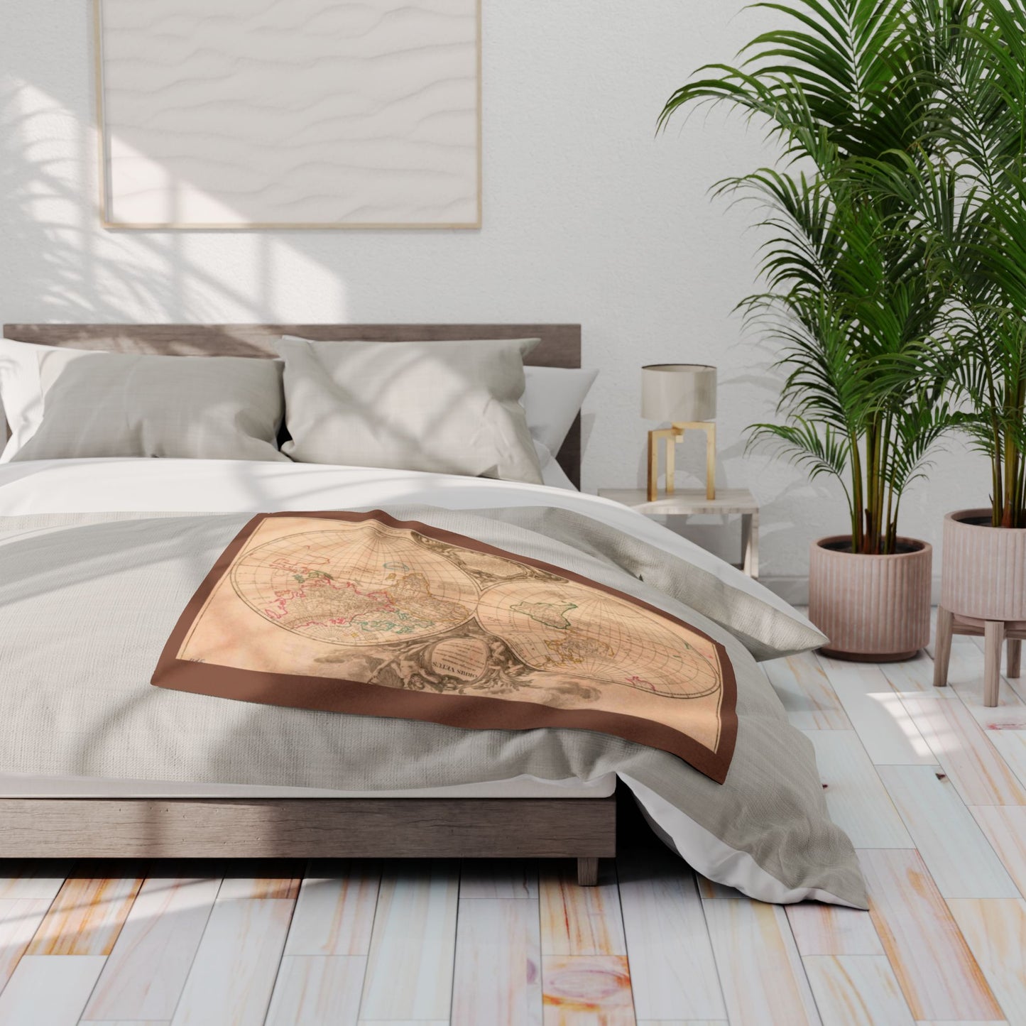 Bedroom with a decorative blanket featuring an old map design on a bed.