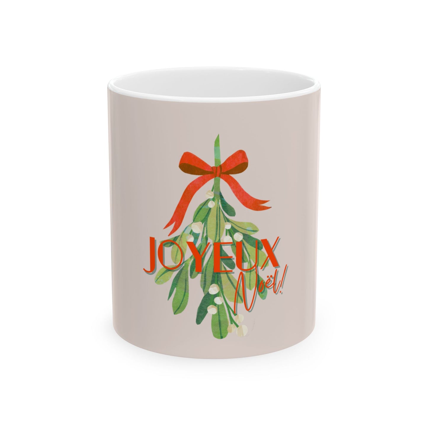 White mug with Christmas design featuring a red bow and green leaves with 'JOYEUX NOEL' text on a white background.