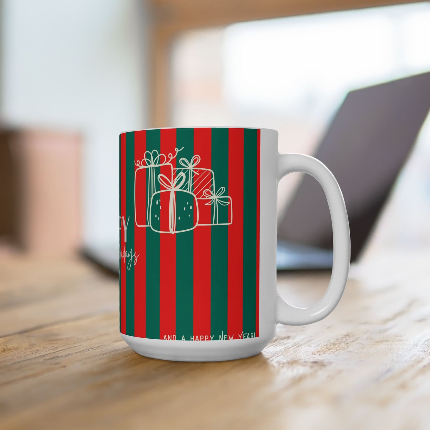 Mug with red and green striped design featuring gift boxes on a wooden surface.