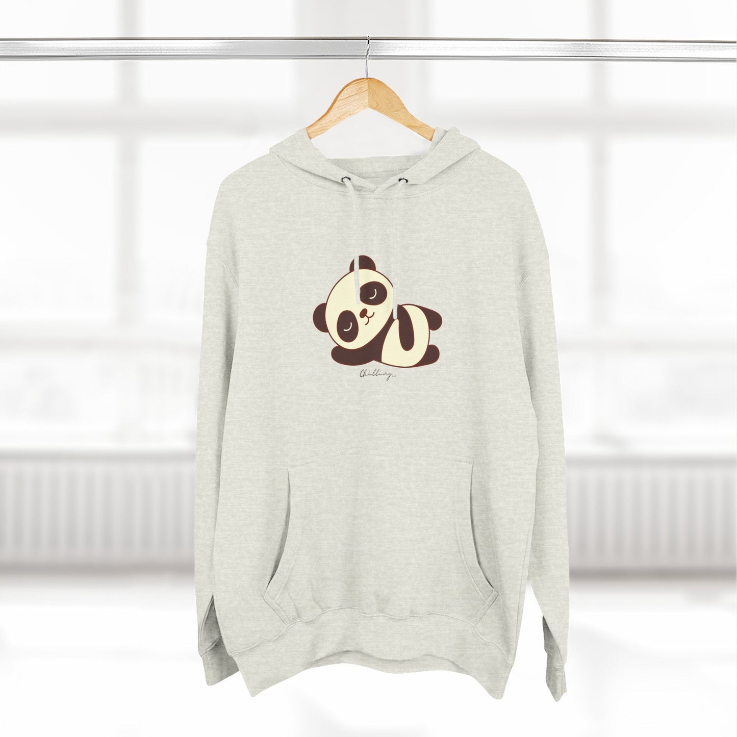 Gray hoodie with a panda design on a hanger against a white background