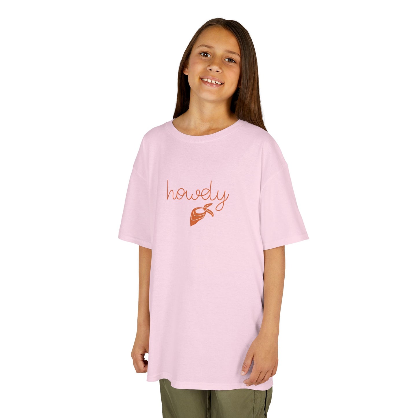 Young girl wearing a pink t-shirt with 'howly' printed on it against a white background
