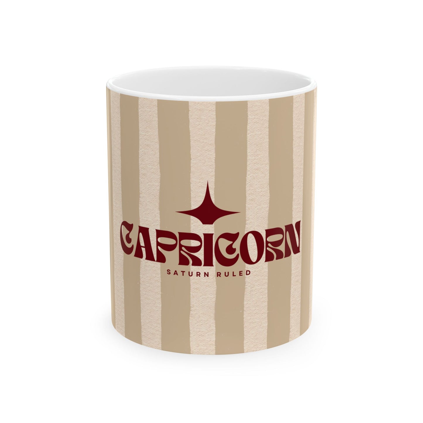 Mug with 'Capricorn' design on a beige and white striped background