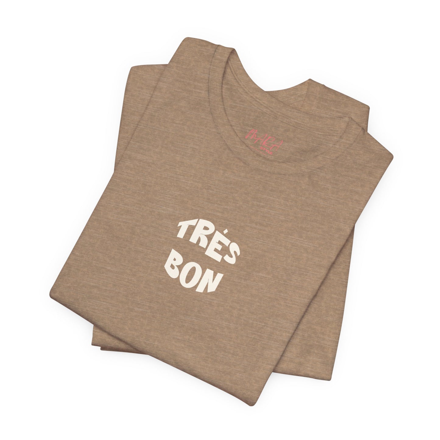 Folded brown t-shirt with 'TRèS BON' text on a white background