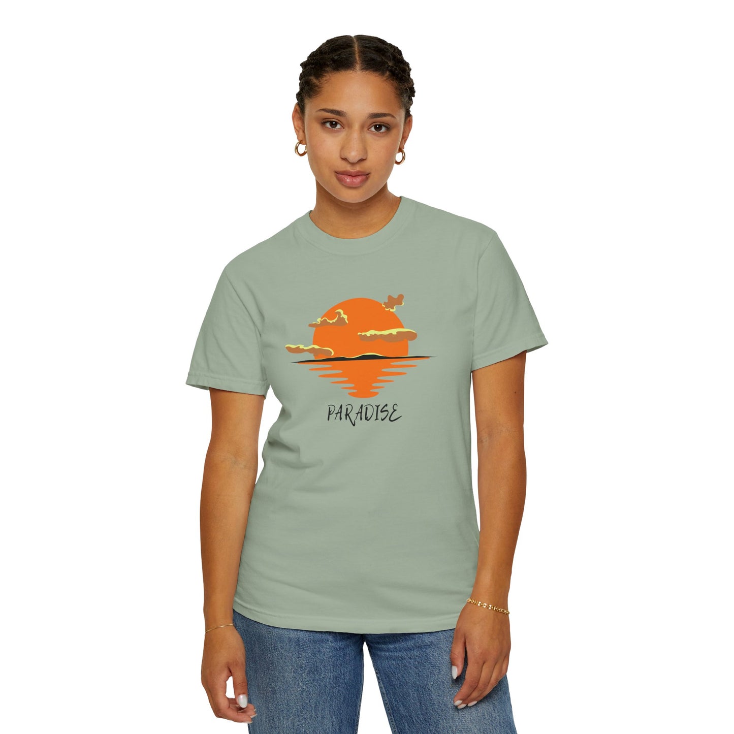 Person wearing a light green t-shirt with a sunset design and 'Paradise' text on a white background