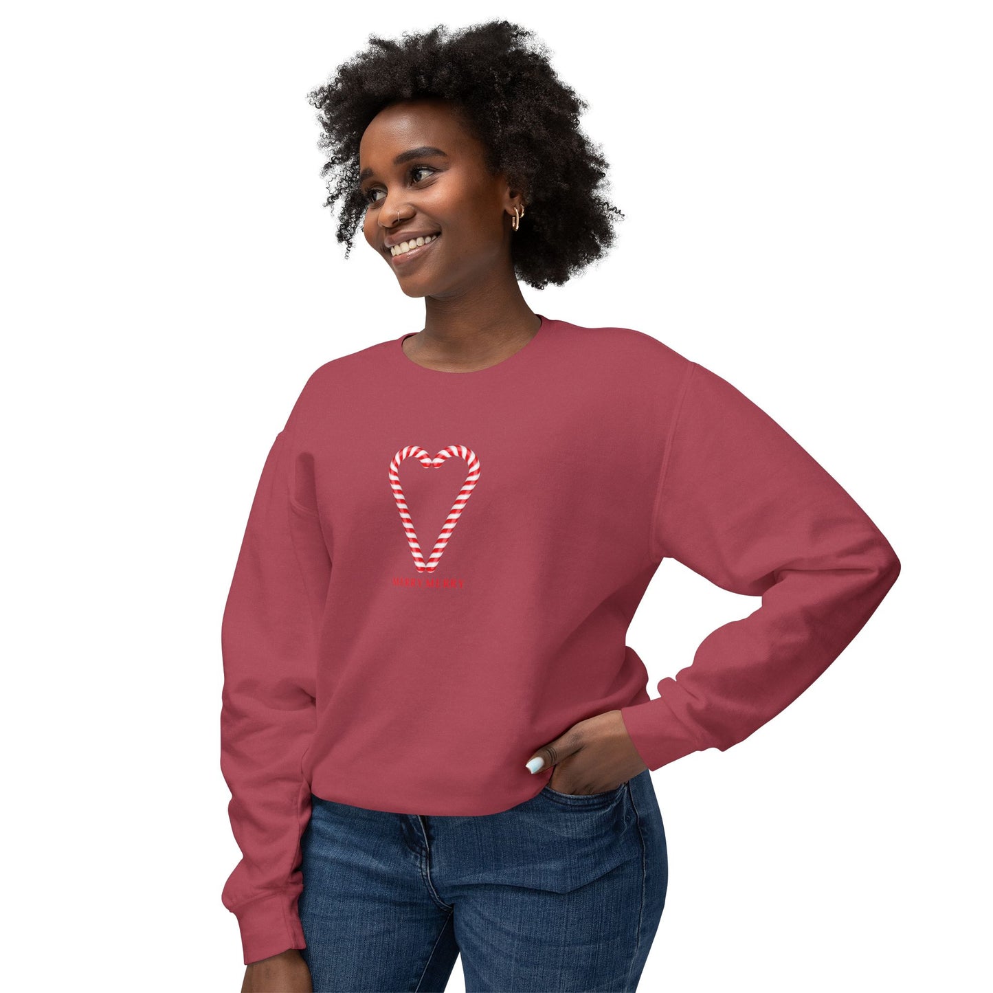 Woman wearing a red sweatshirt with a heart design on a white background