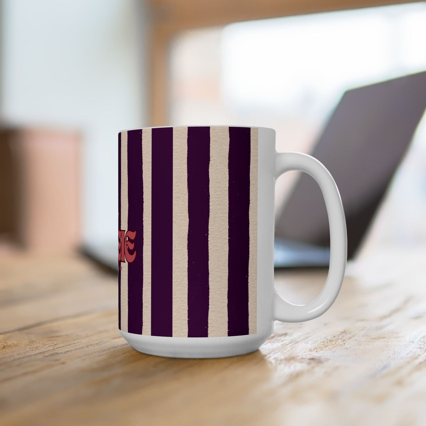 White mug with purple and beige stripes on a wooden surface