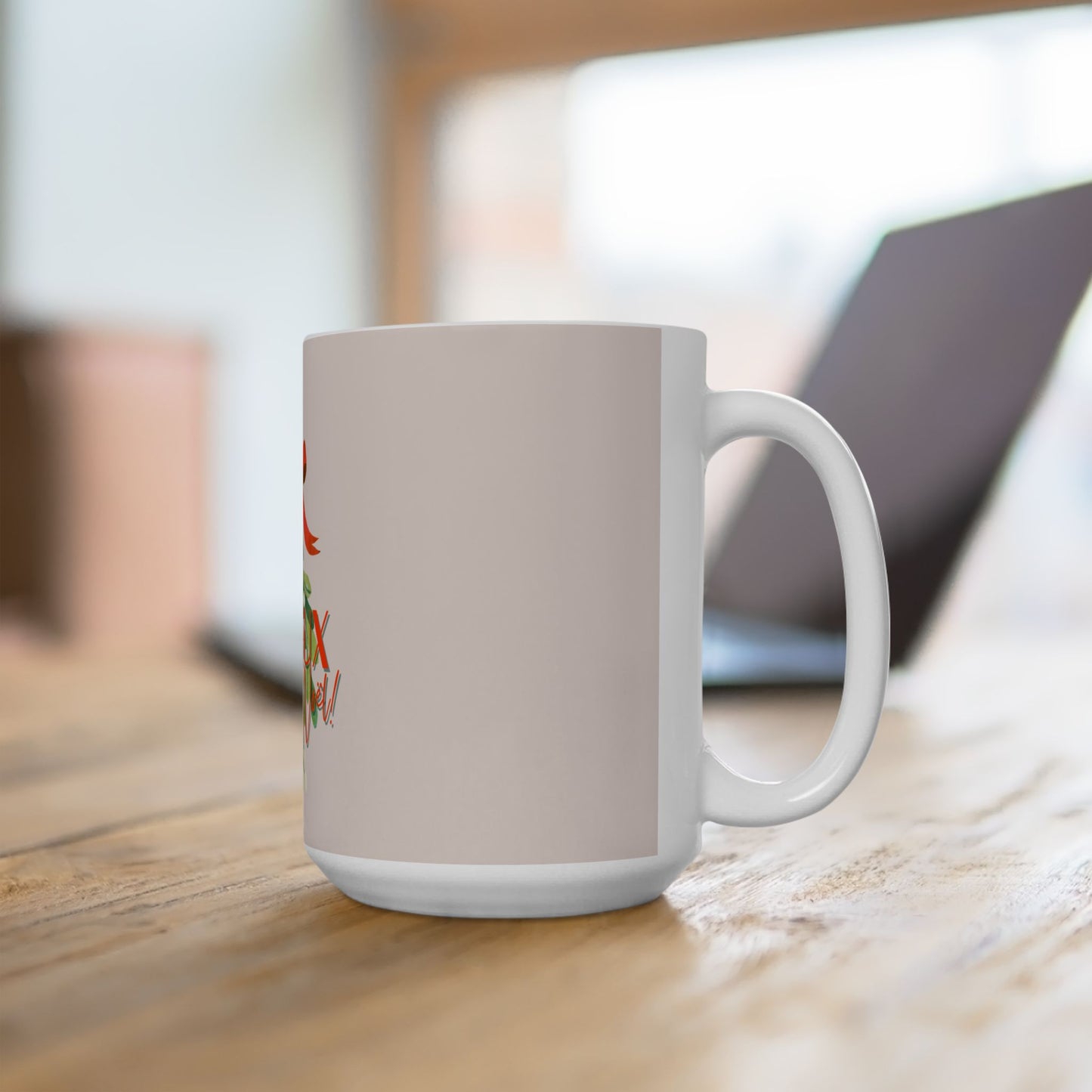 White mug with a colorful design on a wooden surface