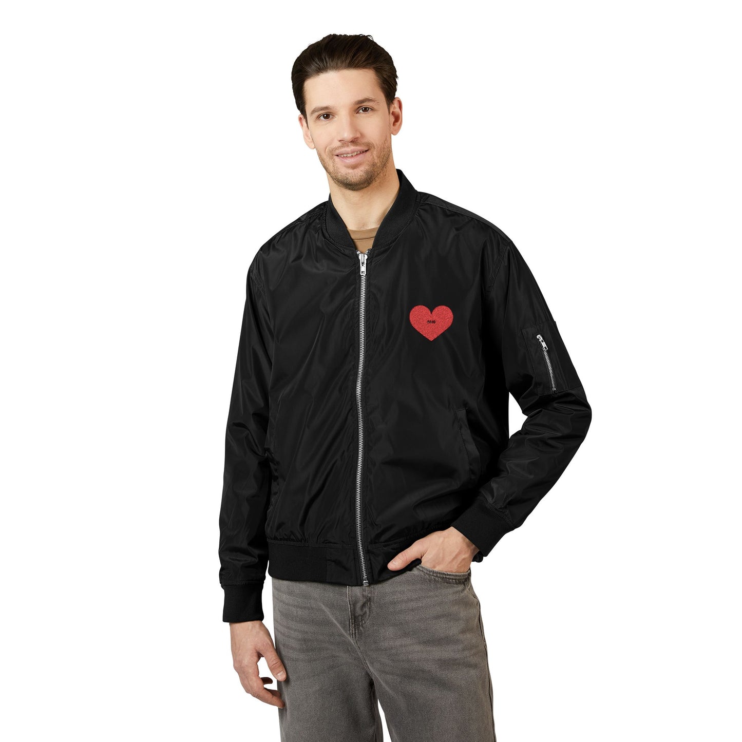 Man wearing a black bomber jacket with a red heart emblem on a white background