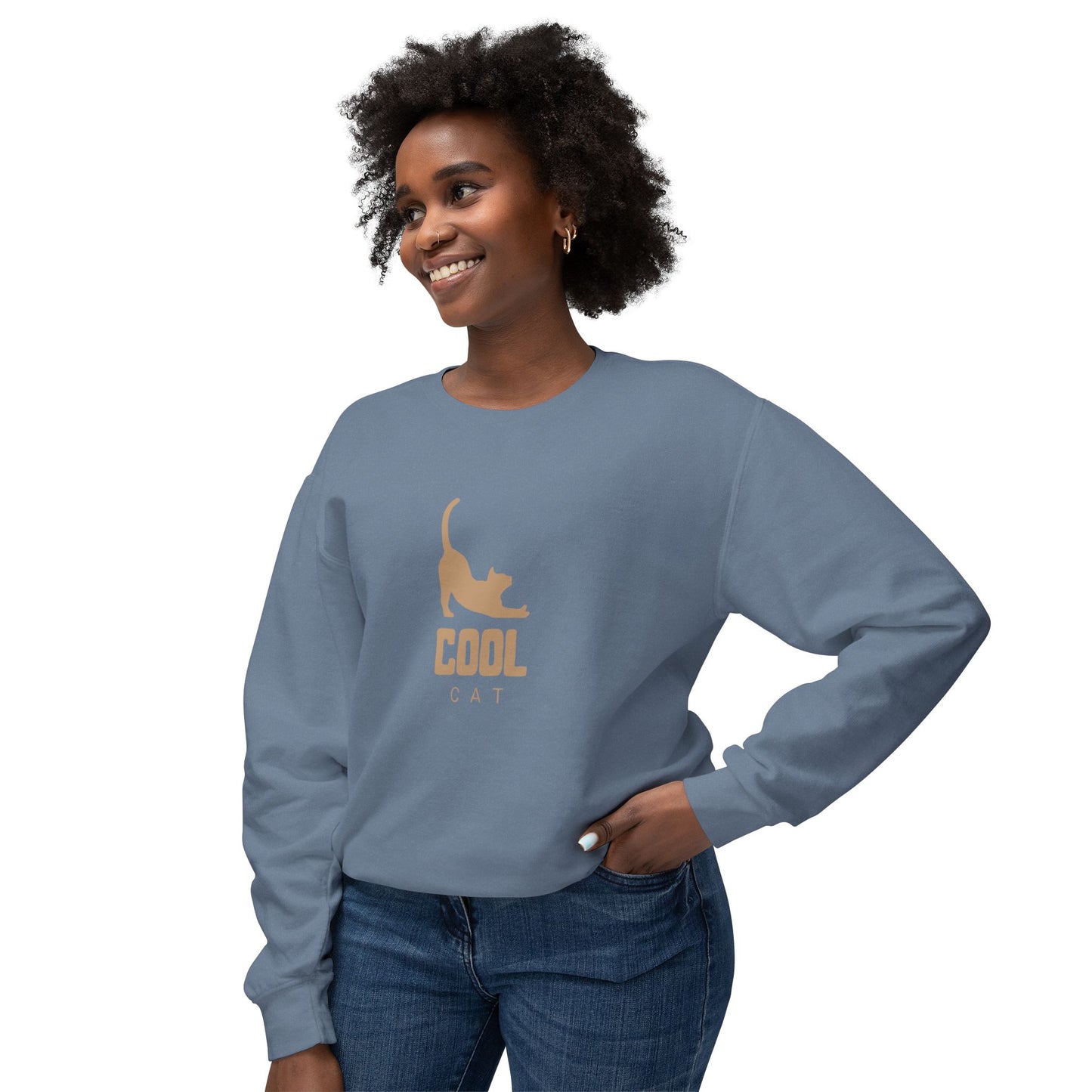 Woman wearing a blue sweatshirt with a cat graphic and 'COOL CAT' text on a white background