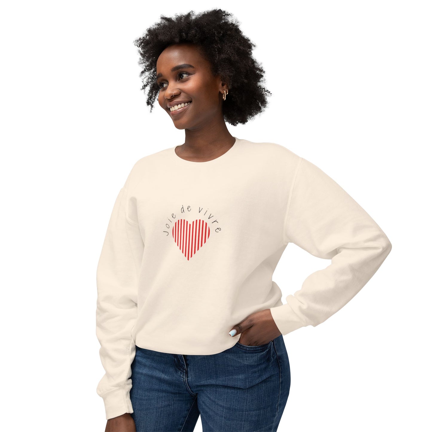 Woman wearing a cream sweatshirt with a red heart design with Joie de Vivreon a white background