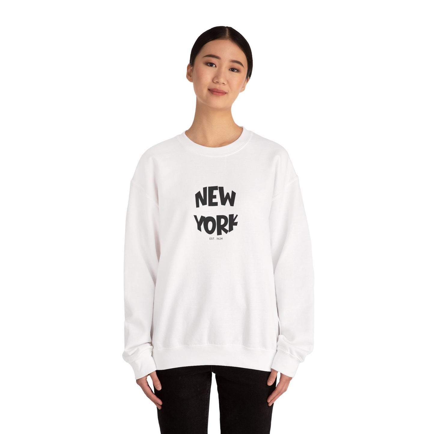 Person wearing a white sweatshirt with 'New York' text on a white background