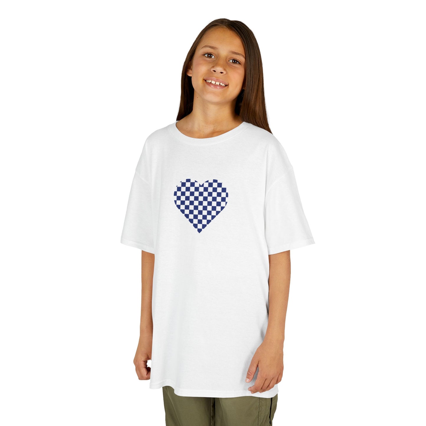 Young girl wearing a white t-shirt with a blue checkered heart design on a white background