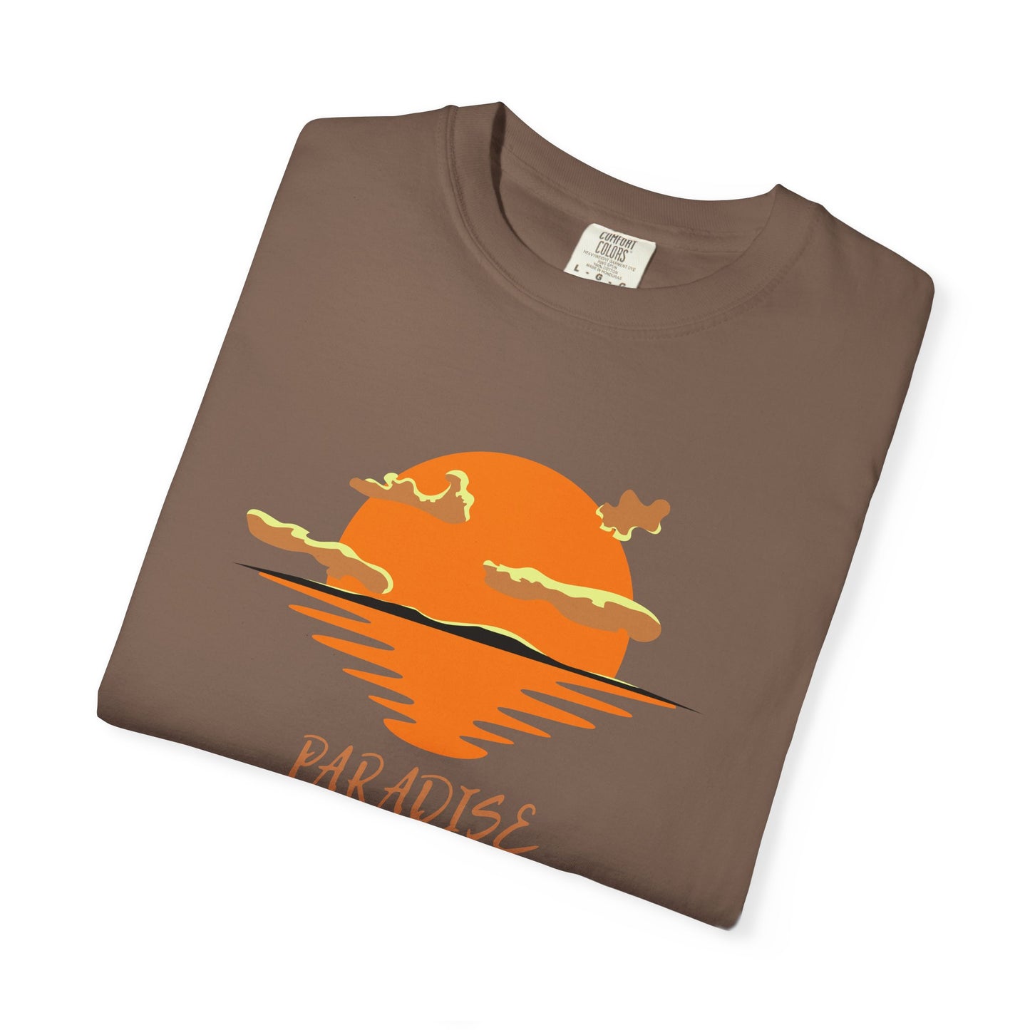Folded brown t-shirt with orange sunset graphic and 'Paradise' text on a white background