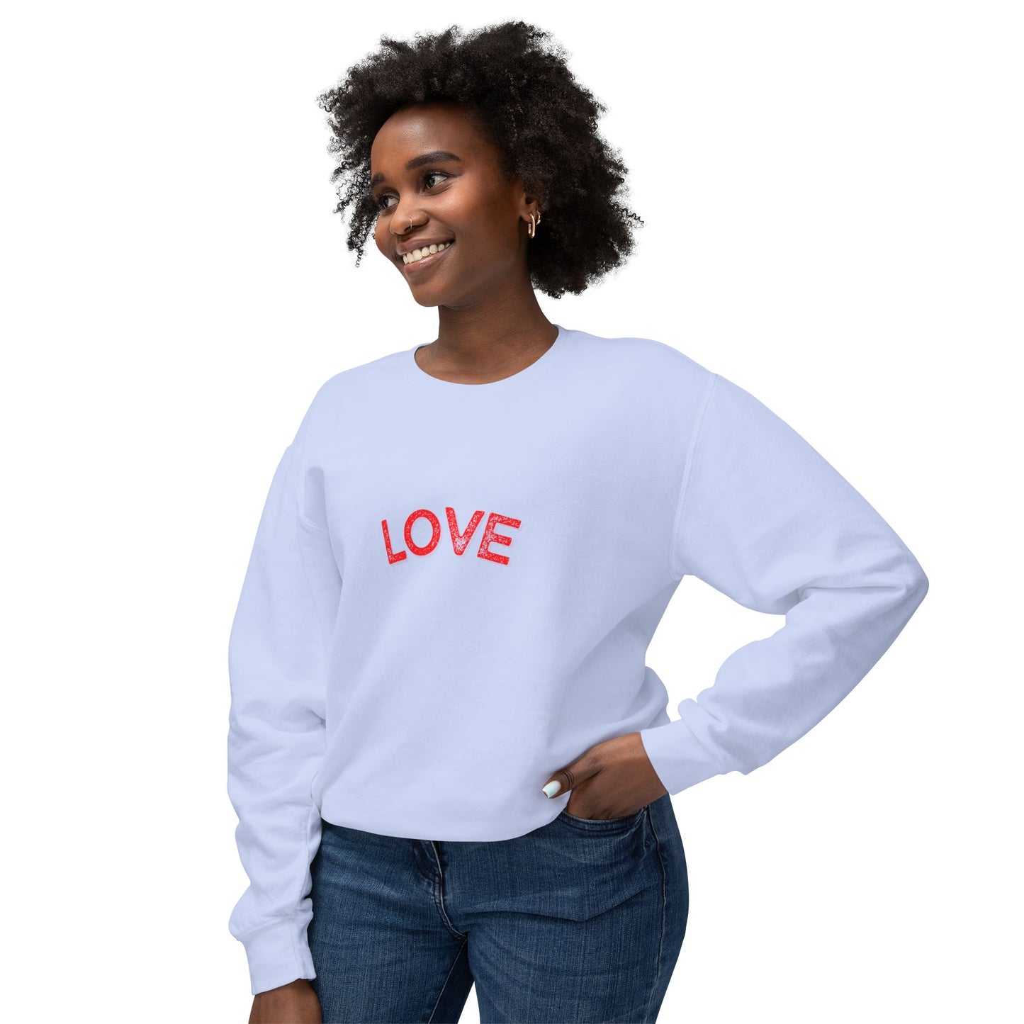 Woman wearing a light blue sweatshirt with 'LOVE' printed in red on a white background