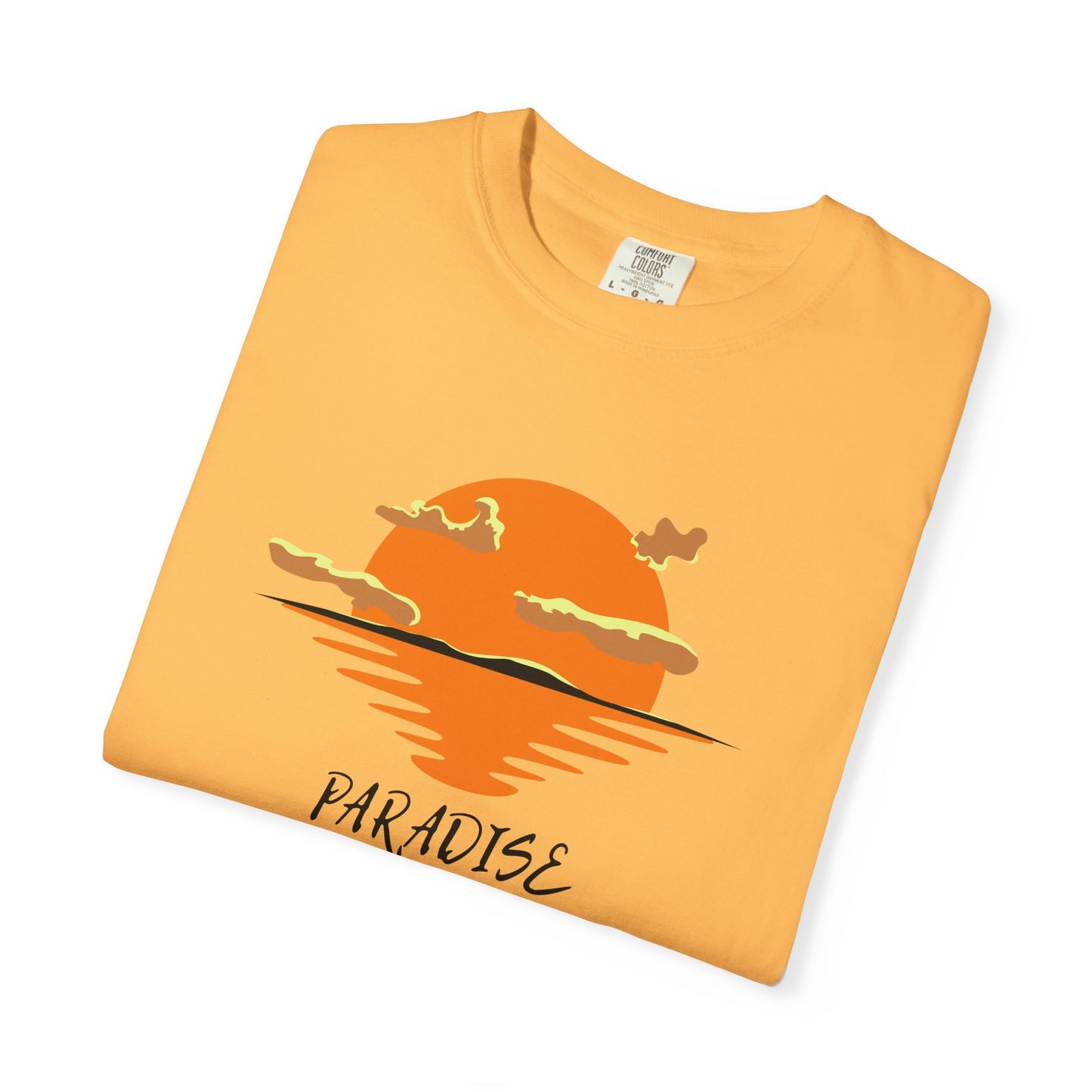 Folded yellow t-shirt with a sunset design and 'Paradise' text on a white background