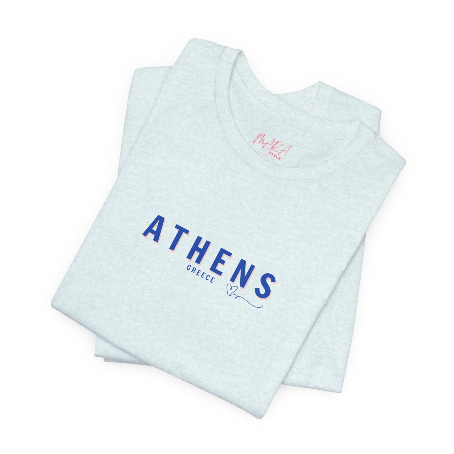 A folded blue t-shirt with 'ATHENS Greece' printed in a blue font on the front.