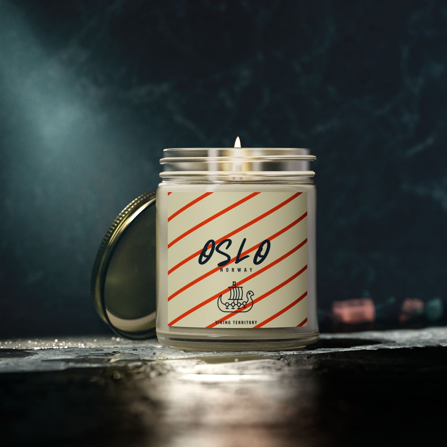 Candle with 'Oslo' label on a dark background