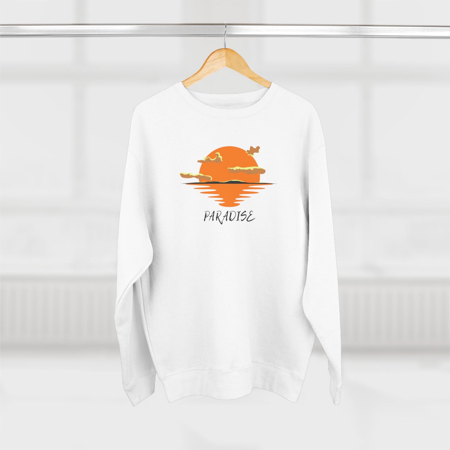 White sweatshirt with a sunset graphic and 'Paradise' text on a white background