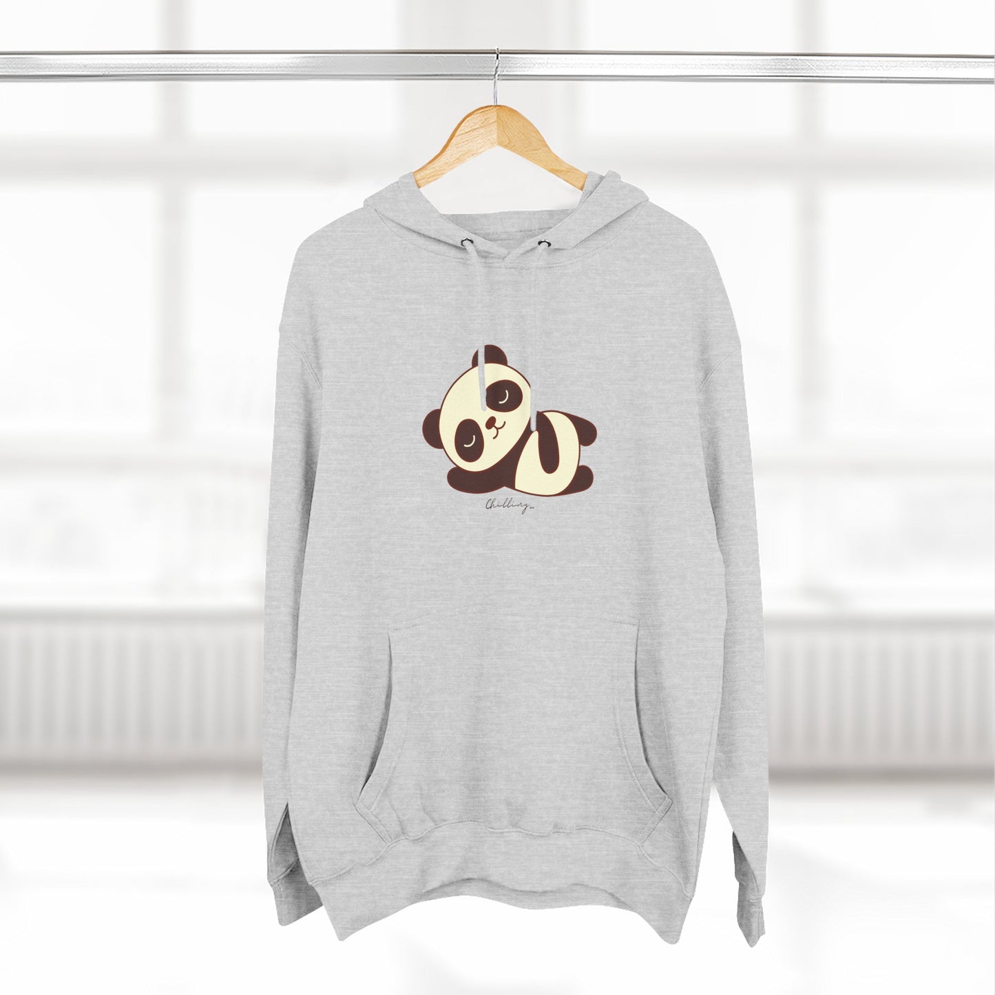 Gray hoodie with a panda design on a hanger against a white background