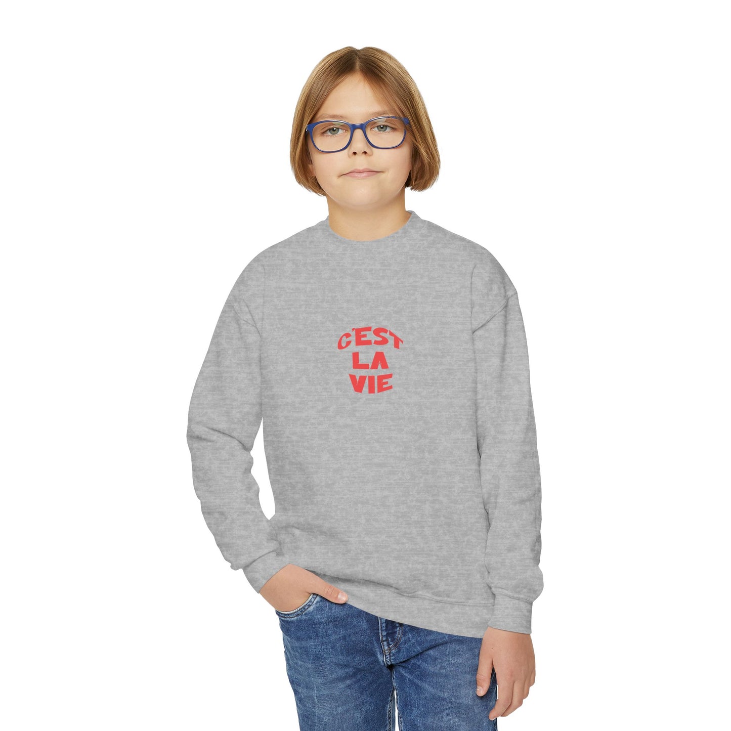 Child wearing a gray C'est la Vie sweatshirt with red text on a white background