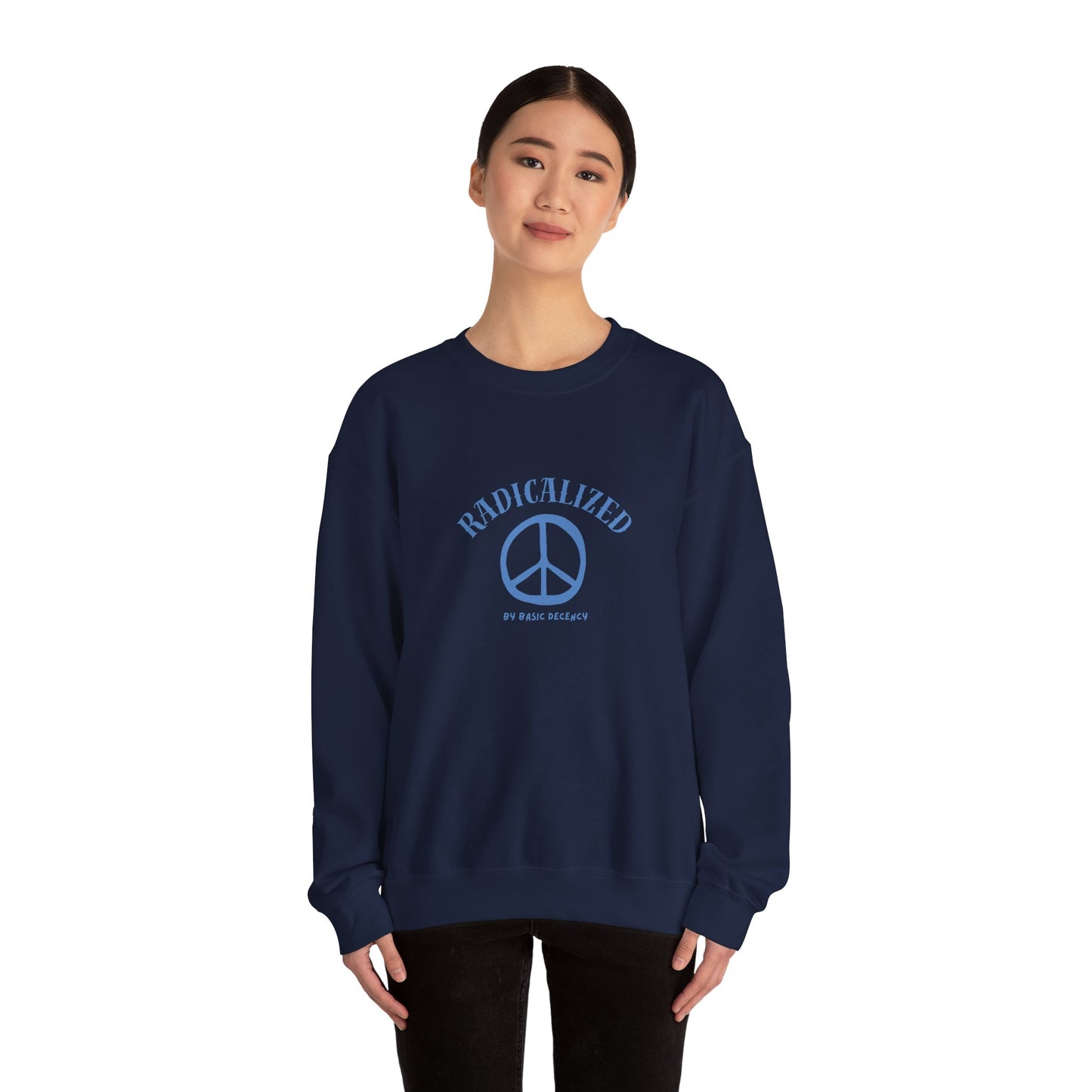 Person wearing a navy blue sweatshirt with a peace symbol design on a white background