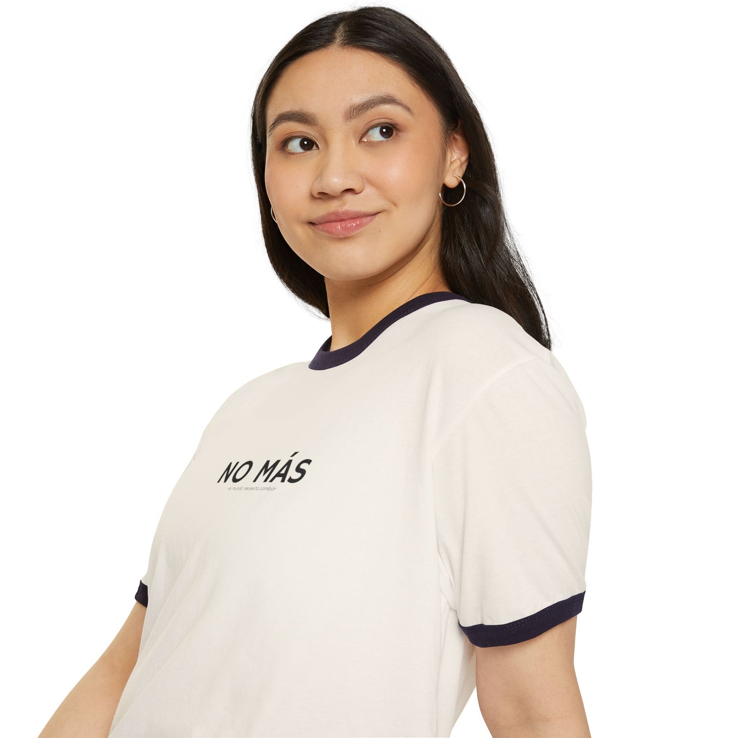 Woman wearing a white t-shirt with 'NO MÁS' text on a plain background