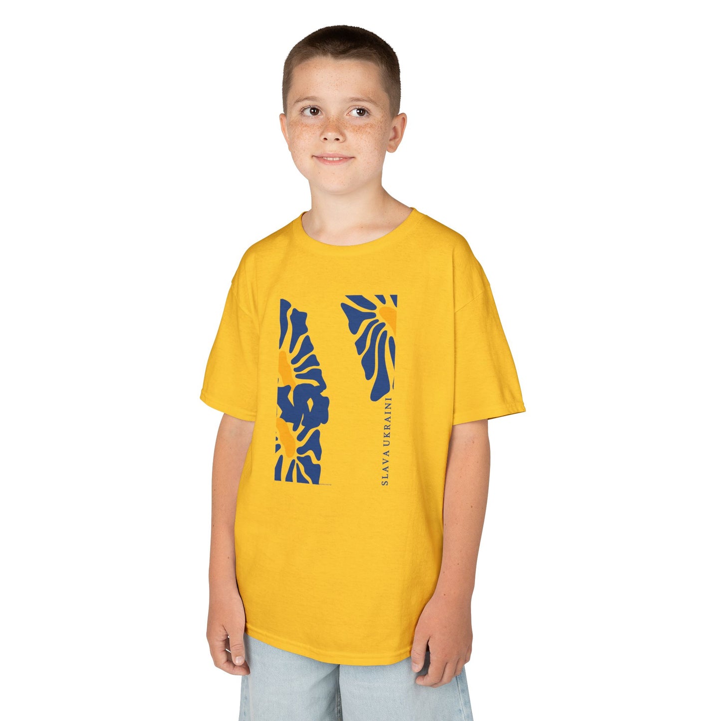 Child wearing a yellow t-shirt with blue SLAVA UKRAINI graphic design on a white background
