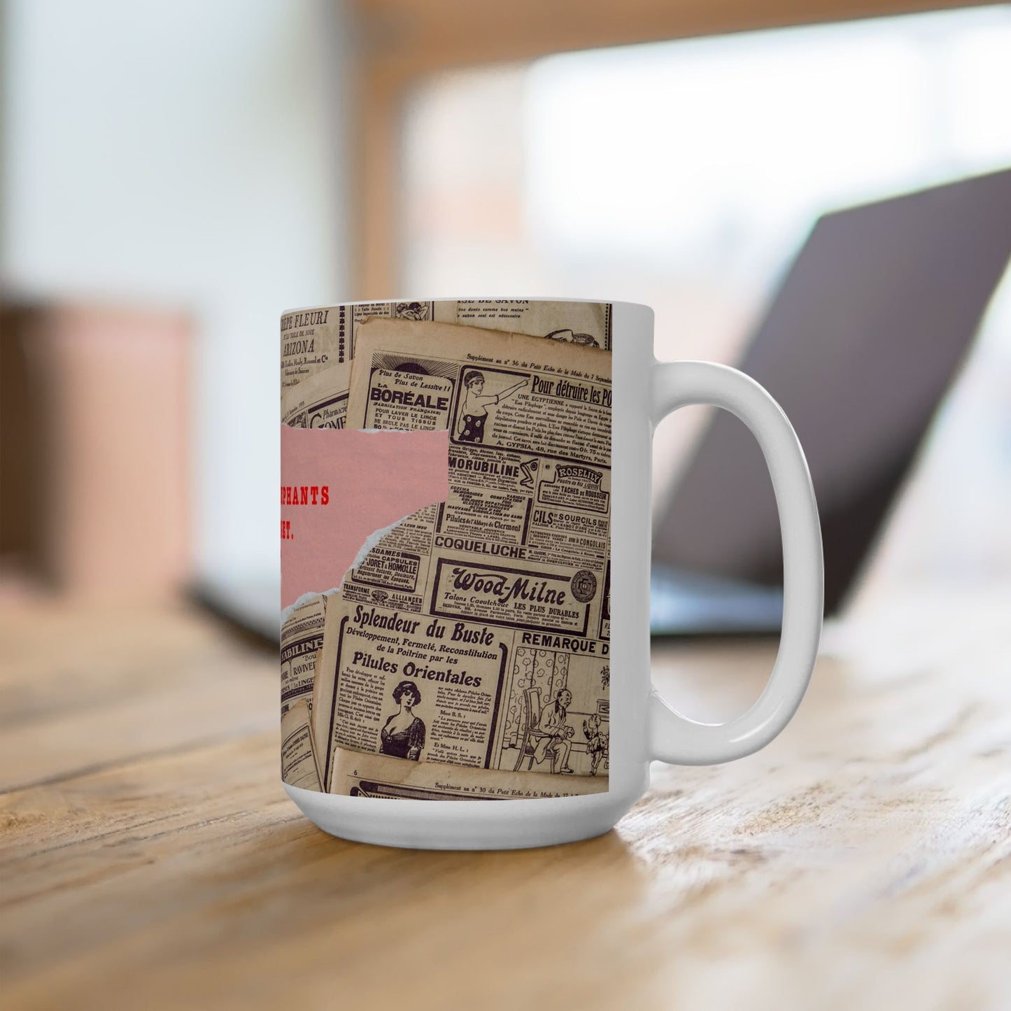 Mug with vintage newspaper design on a wooden surface