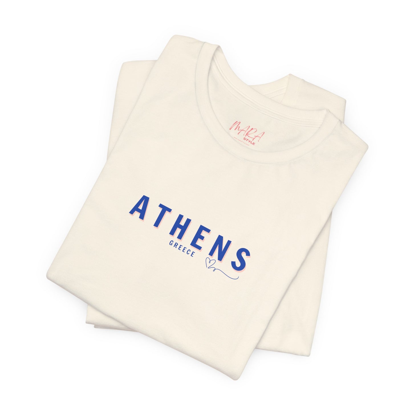 A folded blue t-shirt with 'ATHENS Greece' printed in a blue font on the front.