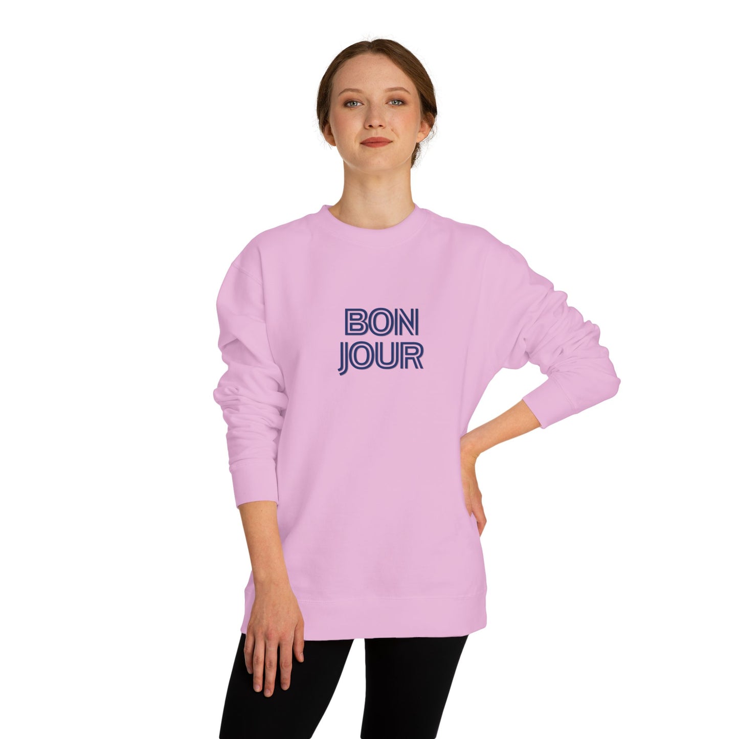 Person wearing a pink sweatshirt with 'BON JOUR' text on a white background