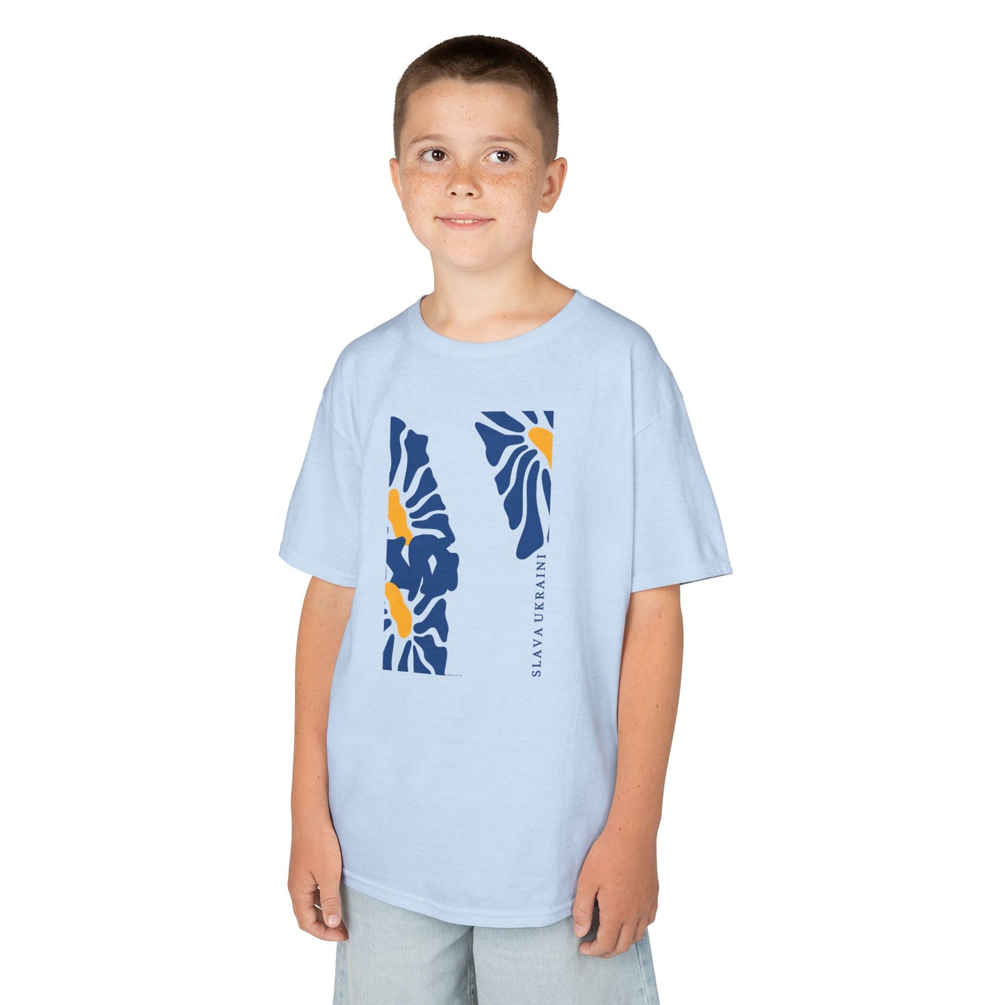 Child wearing a light blue t-shirt with a colorful SLAVA UKRAINI design on a white background