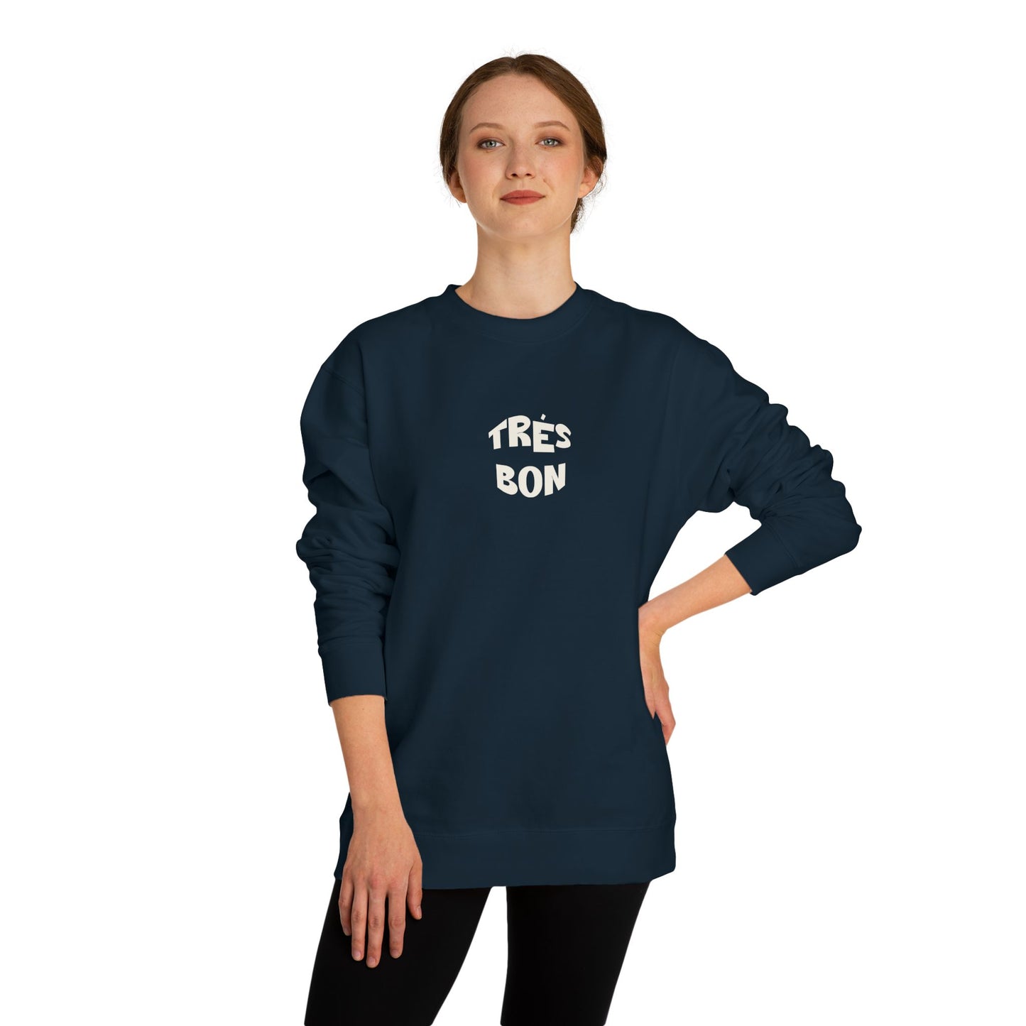 Person wearing a navy blue sweatshirt with 'TRES BON' text on a white background