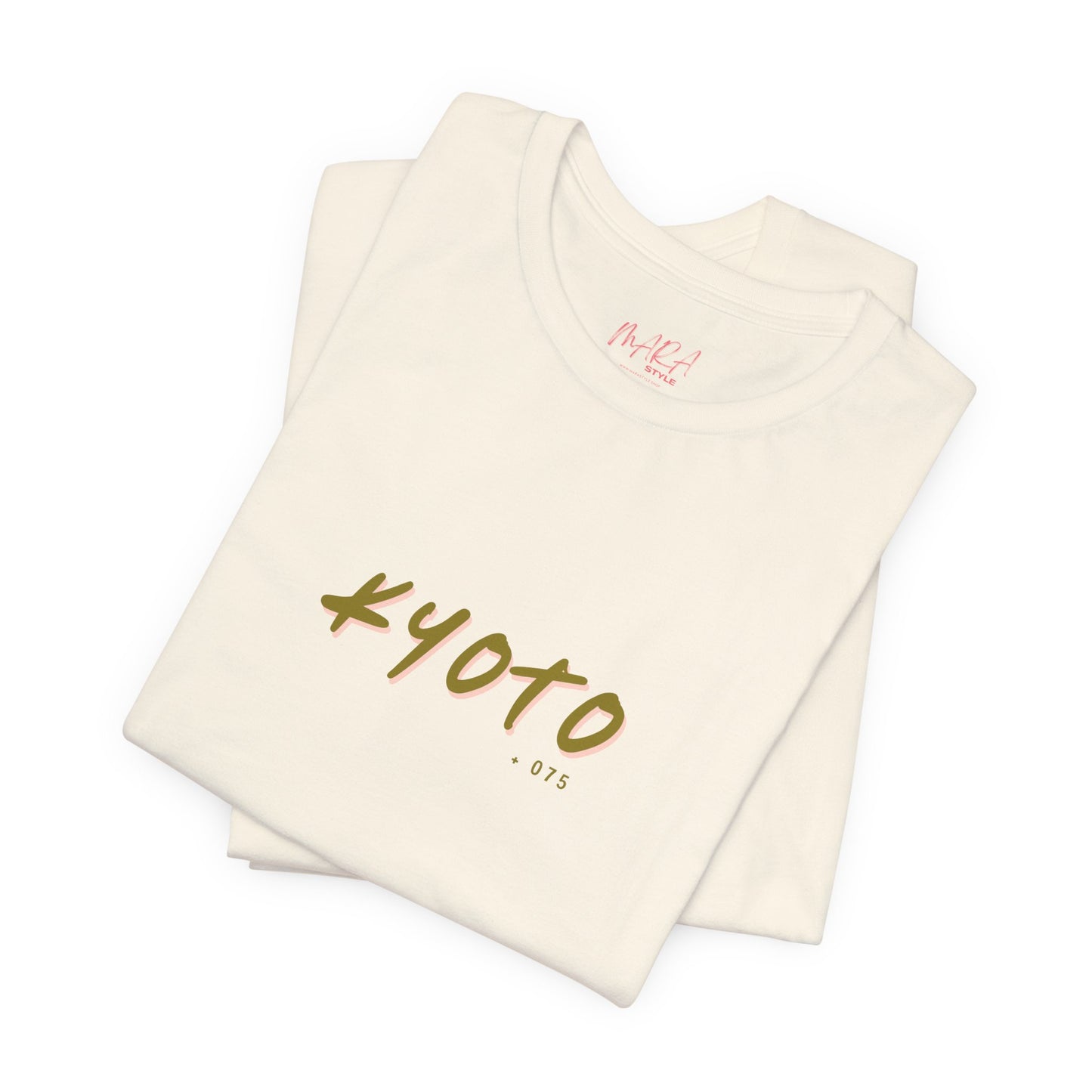 Folded beige fabric with 'Kyoto 075' text on a white background