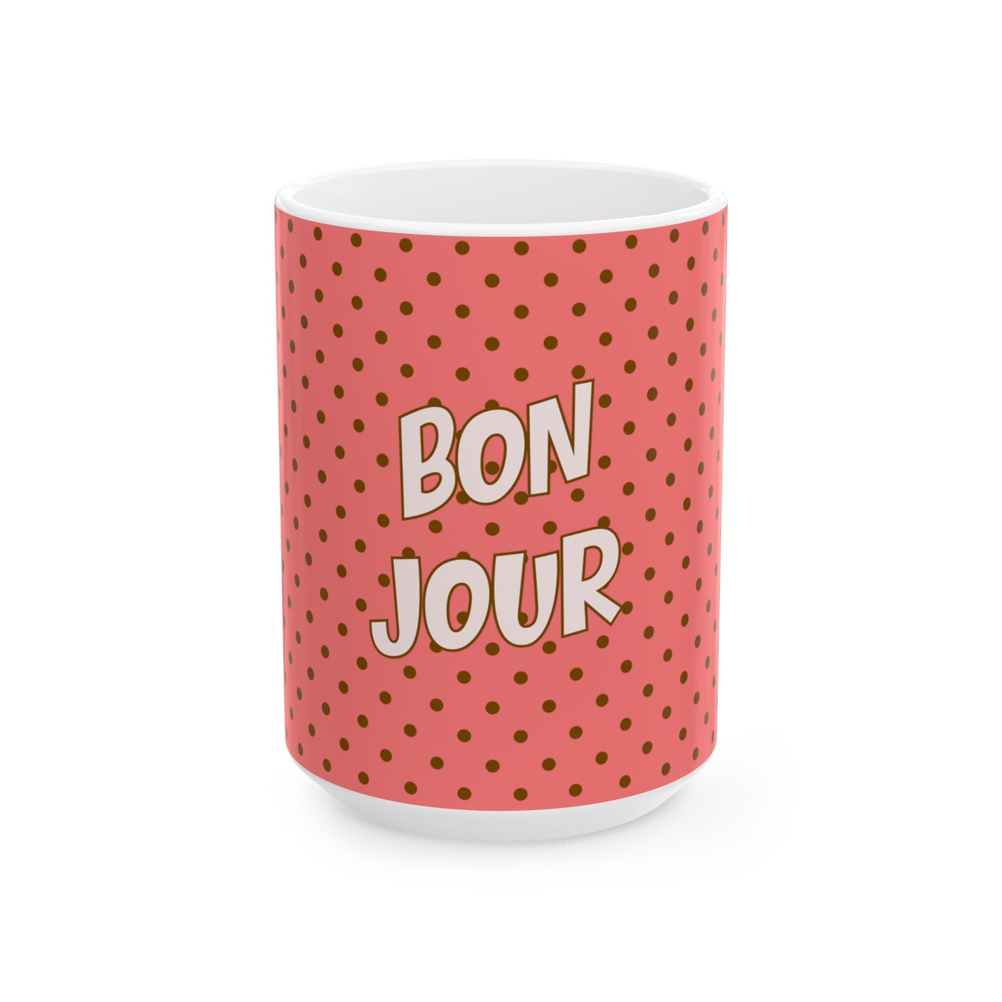 Mug with 'Bonjour' text on a pink polka dot background