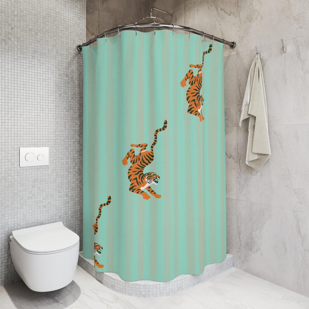 A mint green shower curtain with orange and black tiger illustrations hanging in a modern tiled bathroom next to a toilet and a folded towel.