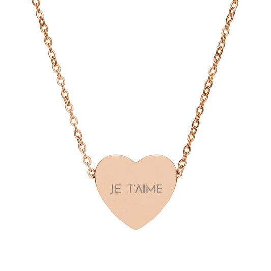 Rose gold heart-shaped necklace with 'JE T'AIME' engraving on a white background