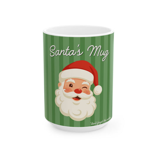 A white ceramic mug featuring a green and dark green striped design with a cartoon Santa Claus face wearing a red Santa hat. The words 'Santa's Mug' are printed in white script across the top.
