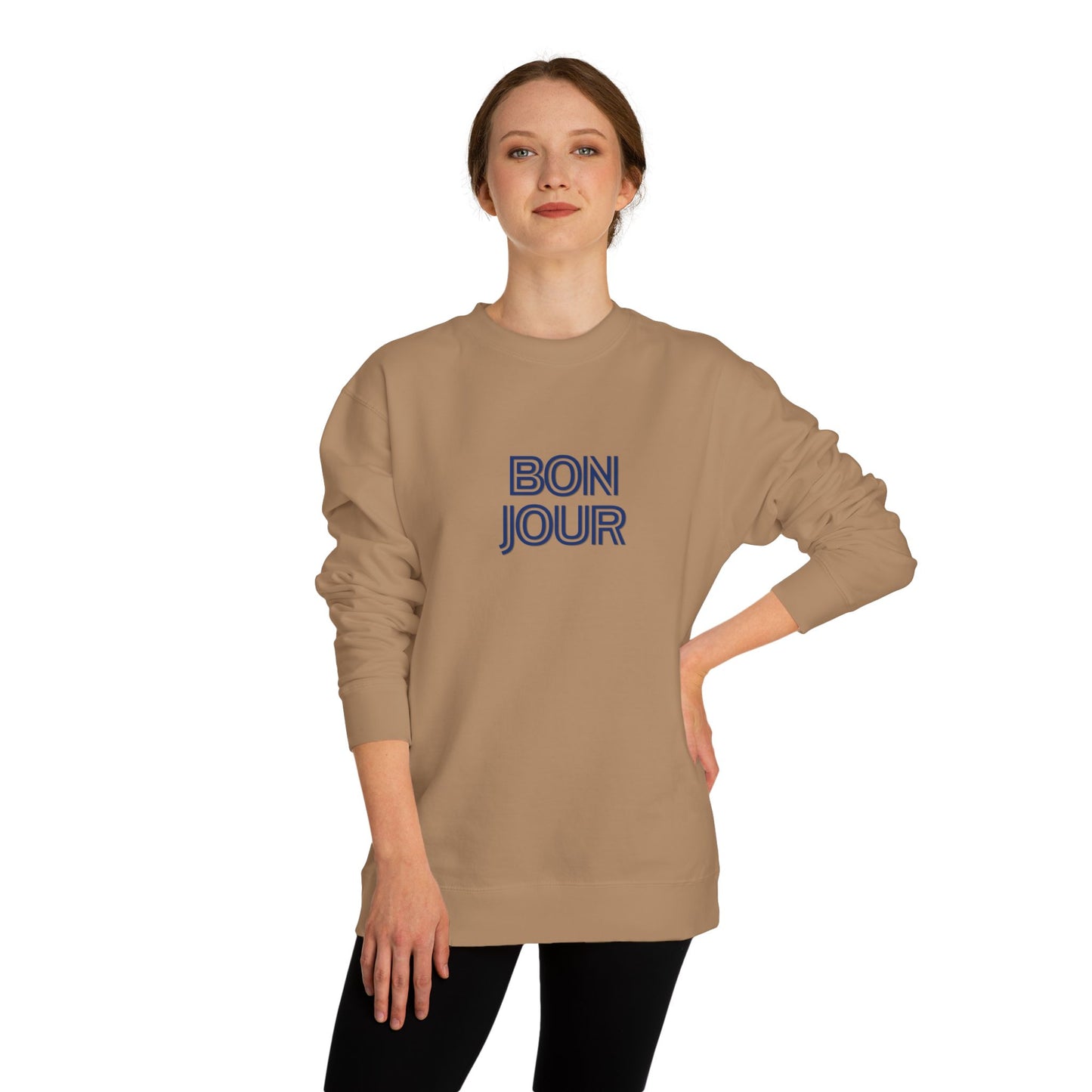 Woman wearing a beige sweatshirt with 'BON JOUR' text on a white background