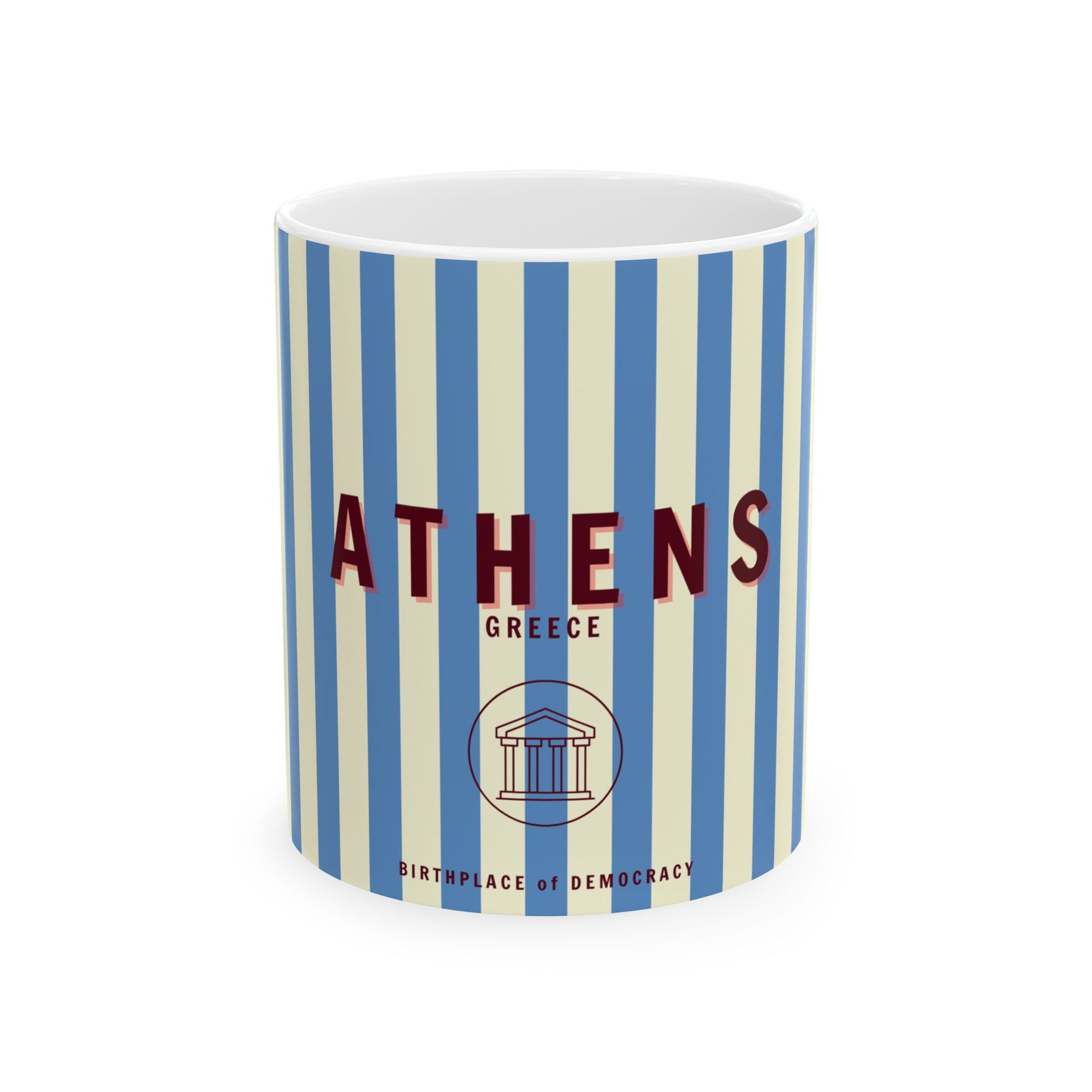 A ceramic mug with blue and white stripes featuring the word 'ATHENS' along with 'Greece' and a classical column illustration.