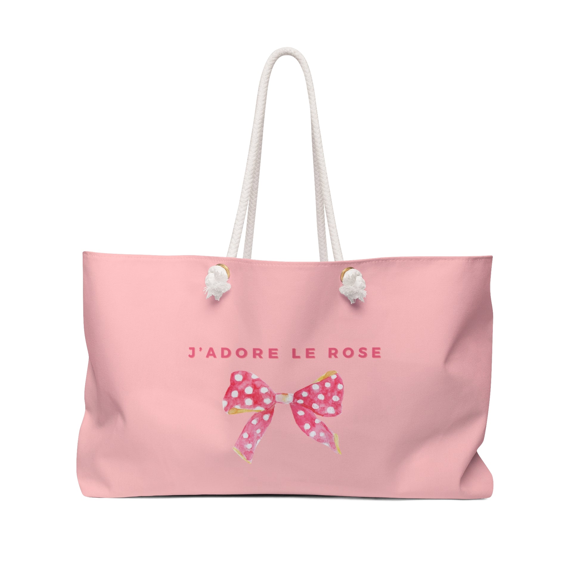 Pink tote bag with a bow and 'J'adore Le Rose' text on a white background