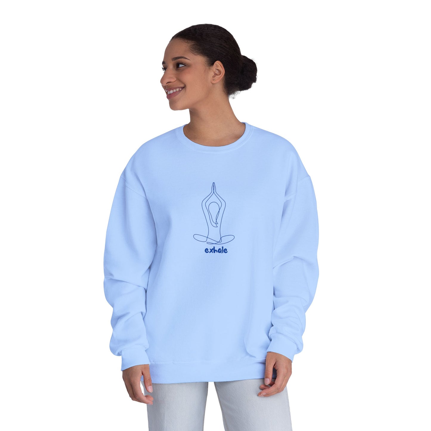 Woman wearing a light blue sweatshirt with a yoga pose design on a white background